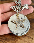 PEACE ON EARTH ORNAMENT WITH DOVE AND GOLD STAR W/CRYSTALS