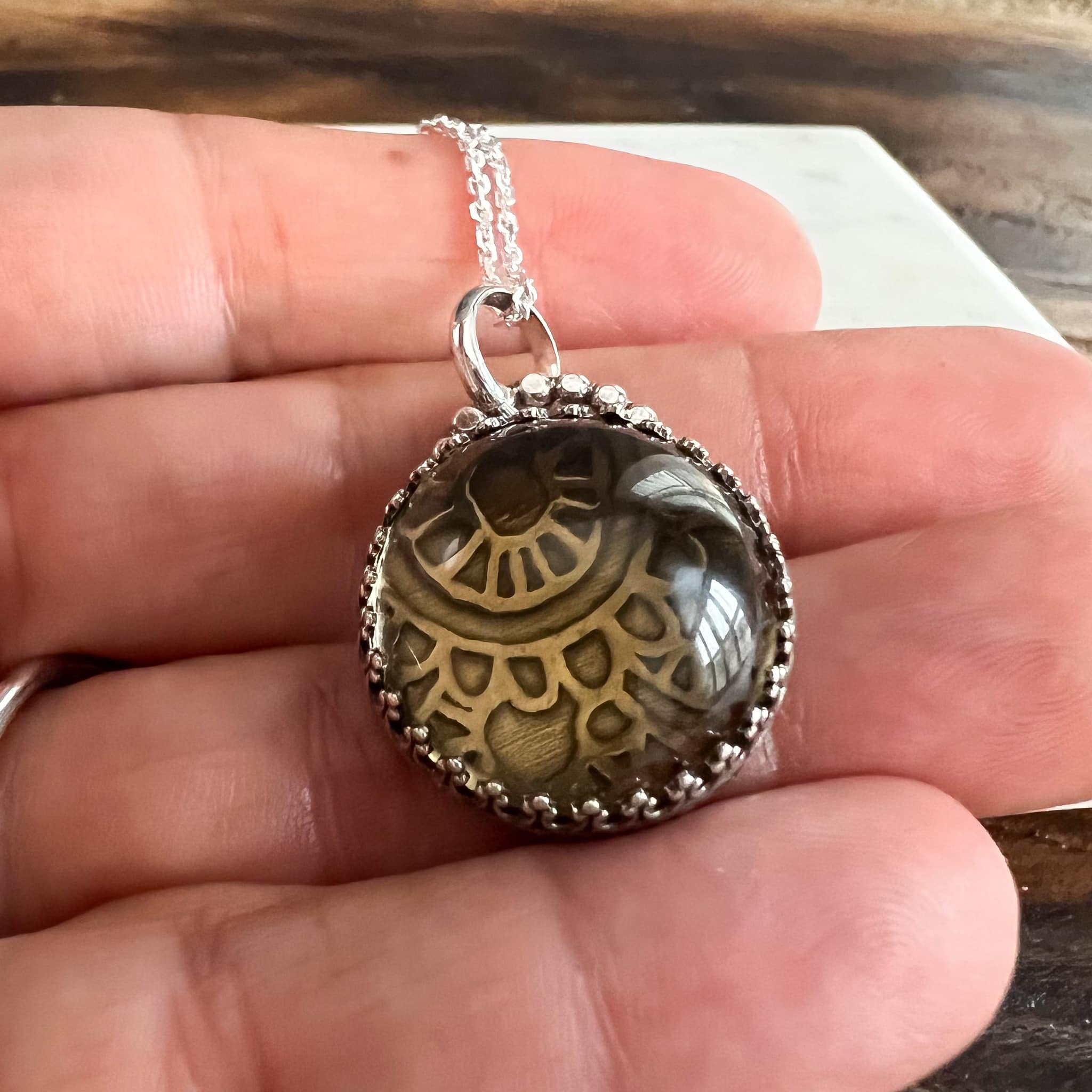 Smokey quartz pendant with whimsical pattern
