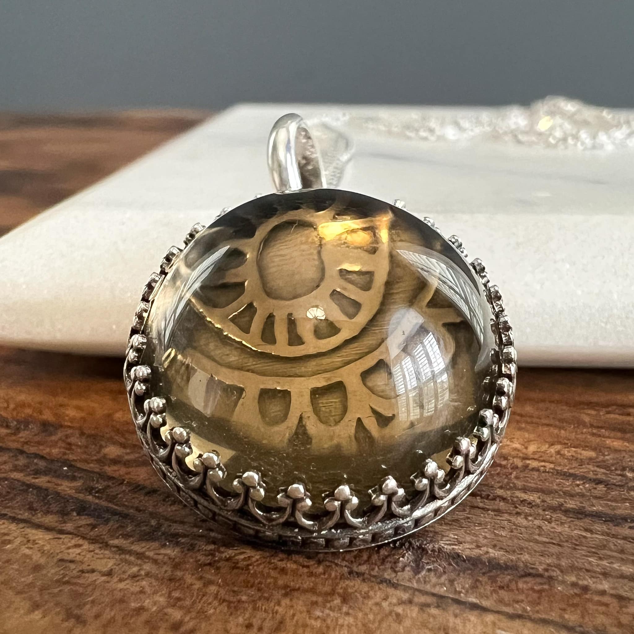 Smokey quartz pendant with whimsical pattern